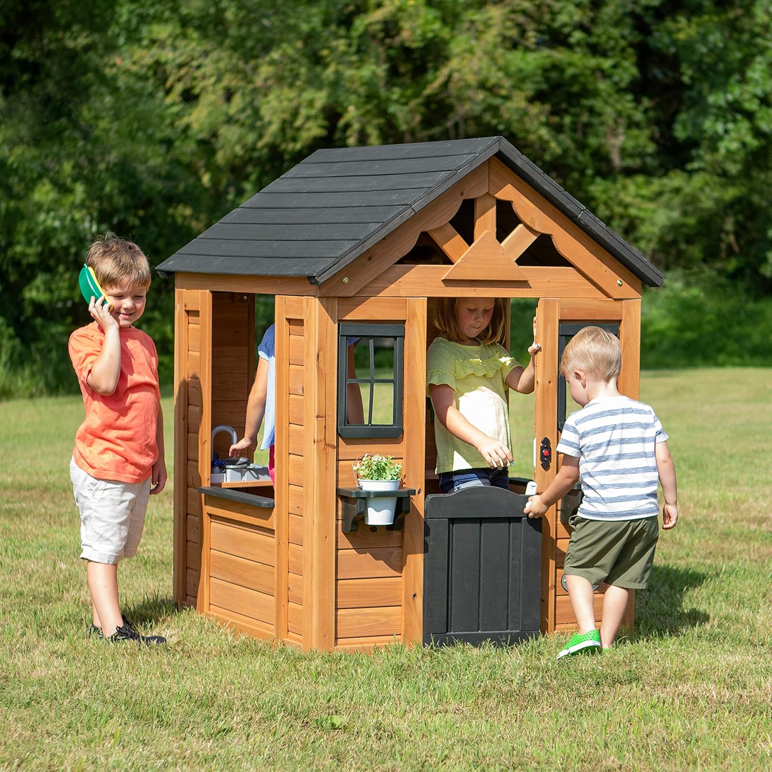 Backyard Discovery Sweetwater Cedar Wooden Kids Playhouse Cottage with Play Kitchen, Snack Bar, Half Door, Toy Phone